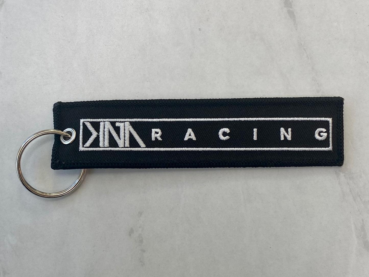 KNA Jet-Tag Keychain